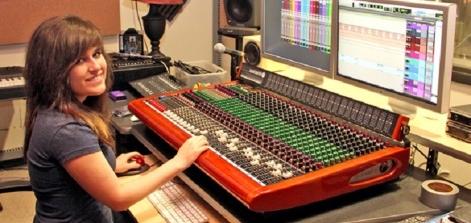A student at a sound board.